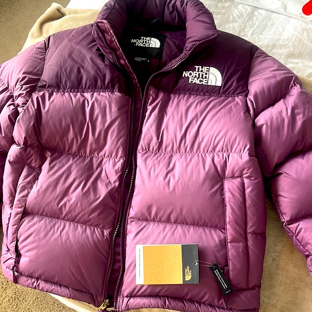 The North Face retro puffer jacket! Plum/purple brand new with tags never worn